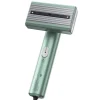 dual-voltage-global-travel-garment-steamer-1 Mint green handheld garment steamer with steam vents.