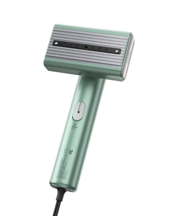 dual-voltage-global-travel-garment-steamer-1 Mint green handheld garment steamer with steam vents.