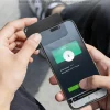 finder-card-tagie-slim-nfc-tap-to-return-setup NFC Tap-to-Return tracker tapped to smartphone for secure contact sharing.