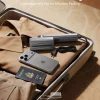 ultra-slim-dual-voltage-global-travel-garment-steamer Ultra-slim portable travel garment steamer packed in suitcase with shirt, iPhone, and passport.